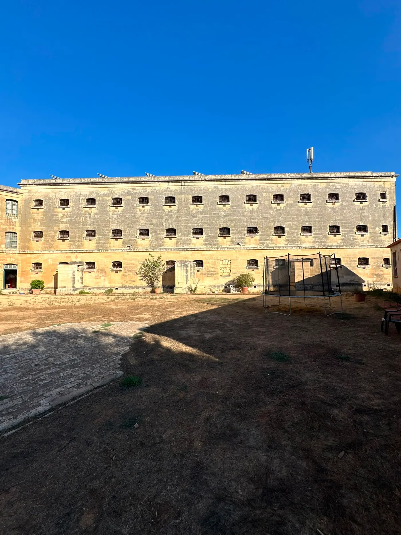Barred cell windows of the historic prison wing